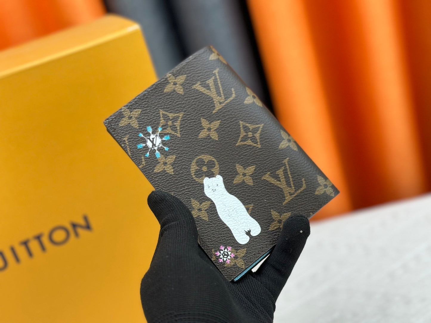 Winter-themed monogram passport cover styled with cold-weather travel essentials
