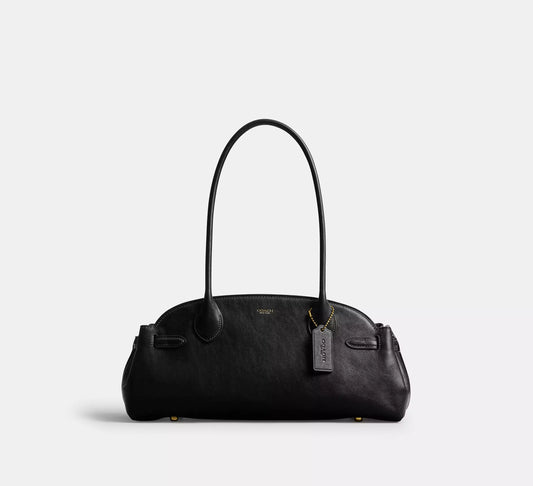 Black Empire Carryall handbag with a visible brand tag on a light gray background