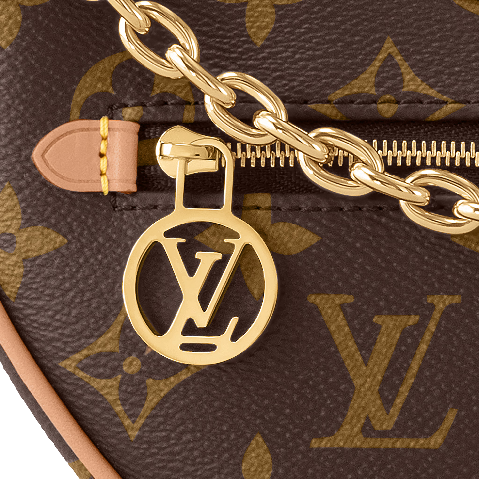 Close-up of a gold chain and LV logo charm on a Louis Vuitton monogram bag.