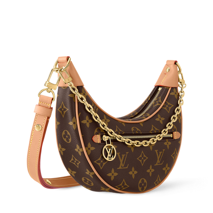 Designer handbag with monogram pattern and gold chain detail on a white background