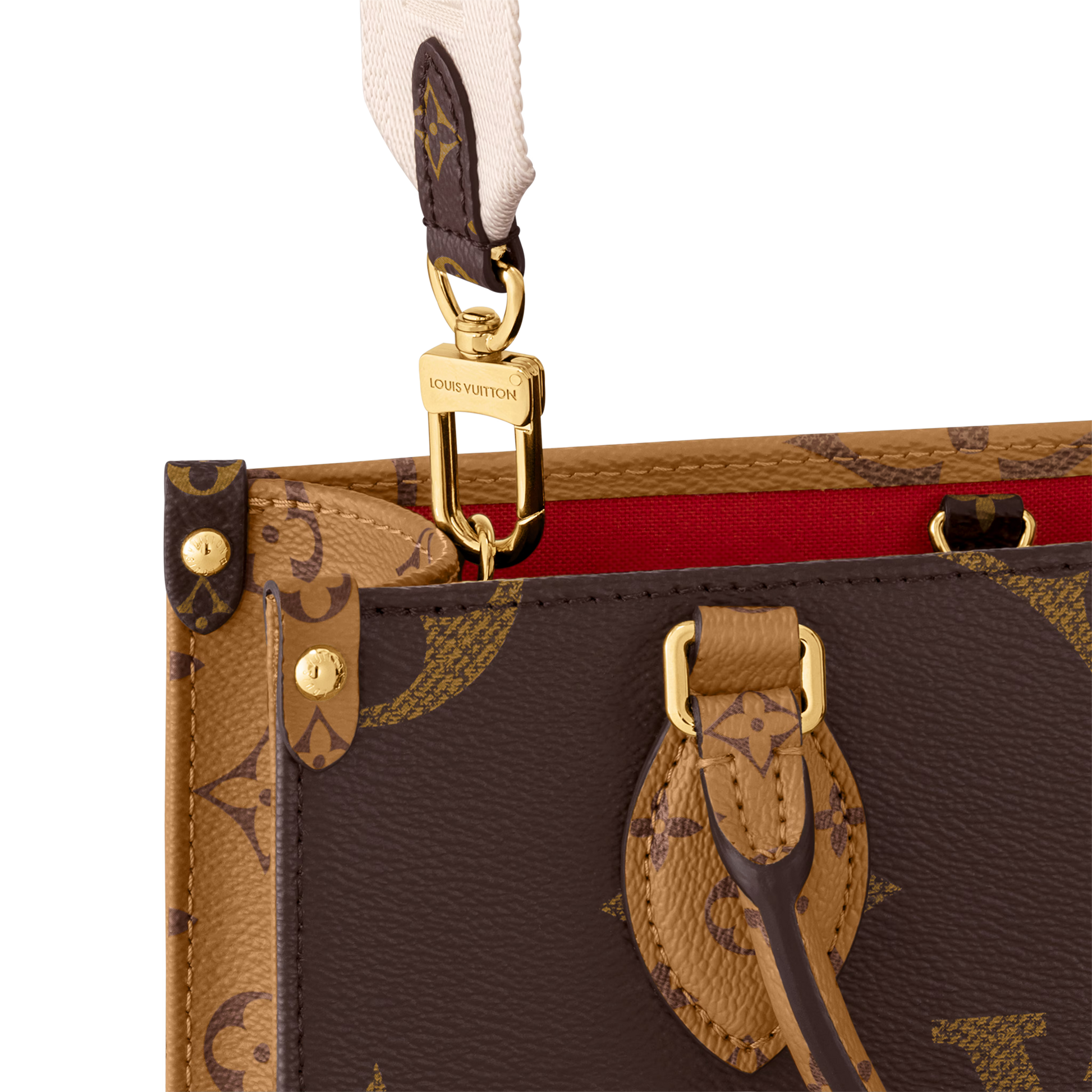 Close-up of a brown leather handbag with gold hardware and monogram pattern.